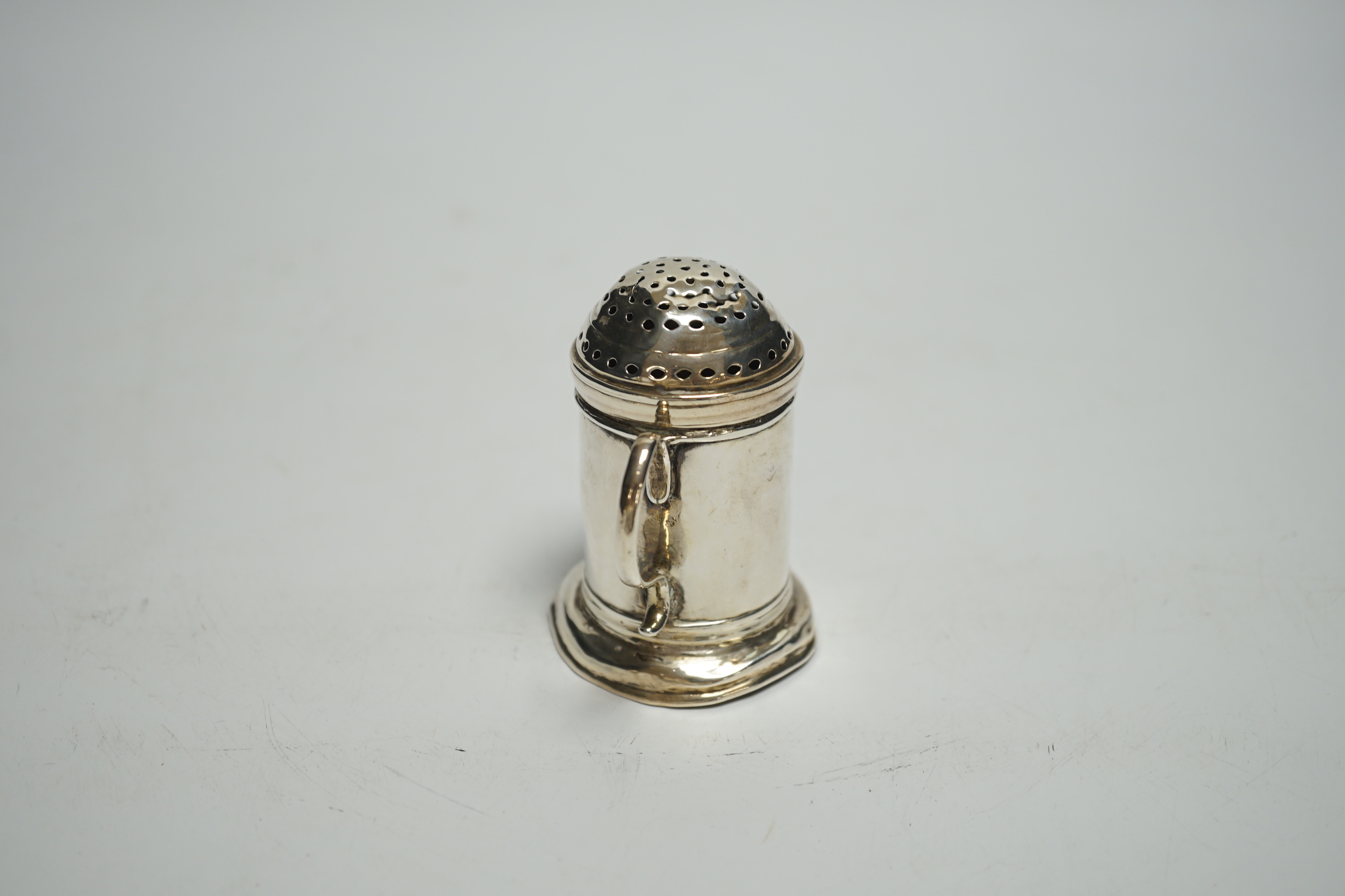 A George I Britannia standard silver kitchen pepper, William Fleming, London, 1718, 67mm, 56 grams.